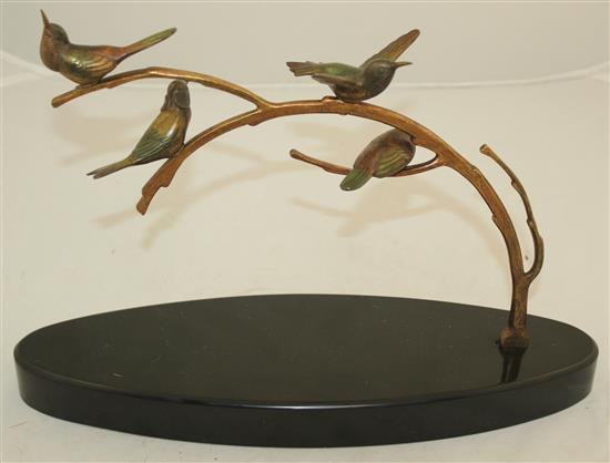 A 1920s French patinated bronze group of four birds upon a branch, L.14in.